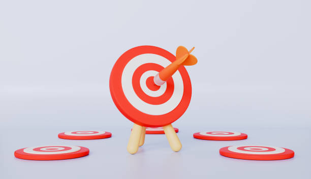 istock Target with checkmark, ladders leaning on red targets on blue wall 2206032405