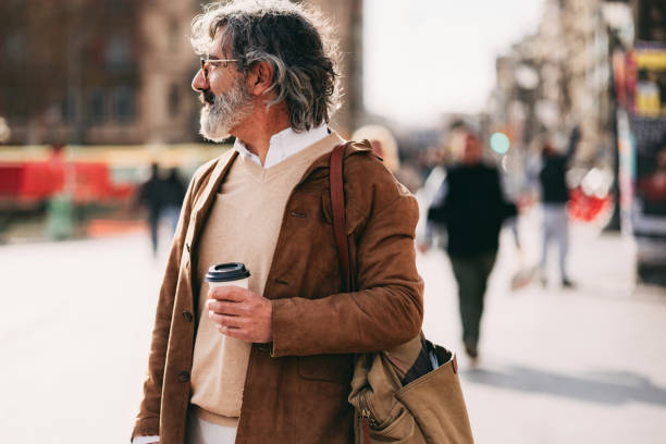 istock Casually Dressed Bearded Man Holding Coffee Cup on City Street 2206033787