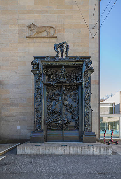 Zurich, Switzerland - 19 March 2025: The bronze sculpure Gate to Hell by Auguste Rodin in front of the Art Museum (Kunsthaus) Zurich.