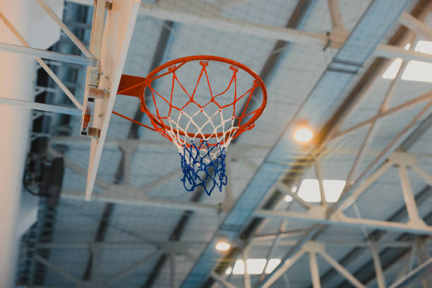 istock Basketball hoop hanging in a modern gym with epoxy floor 2206035493