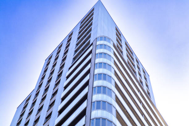 istock A modern high-rise building captured from a low-angle perspective. 2206035716