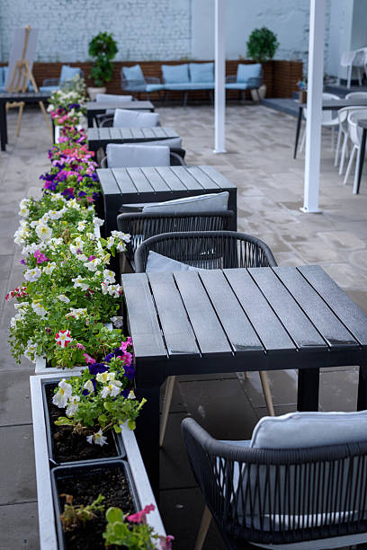 istock Tables in an open-air cafe on the street. 2206037218