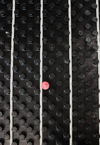 istock Underfloor heating system installation showing modular black panels and white pipes 2206040412