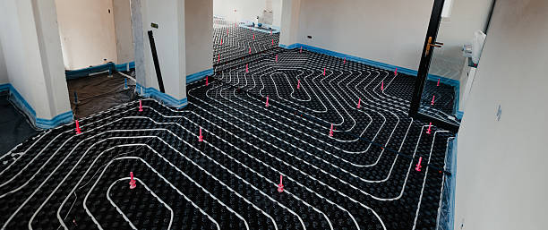 istock Installing underfloor heating system in new home with insulation and pipes 2206040518