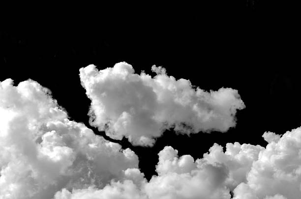 istock Fluffy white clouds isolated on black background. Design concept. Smog. Abstract clouds. Fog over the sky. Cloud or smog background 2206041507