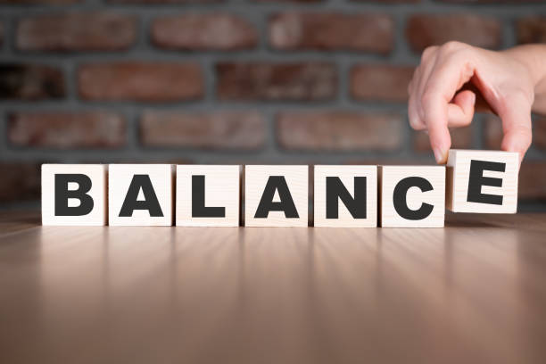 istock Balance word with wooden blocks on table 2206042164