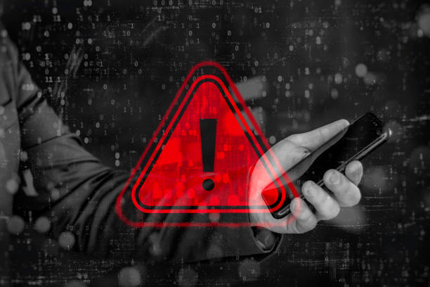 istock Smartphone cybersecurity threat - A businessman with a smartphone is under digital attack. 2206042841