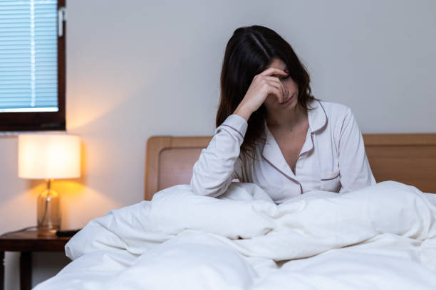 istock woman sleepless at night 2206045306