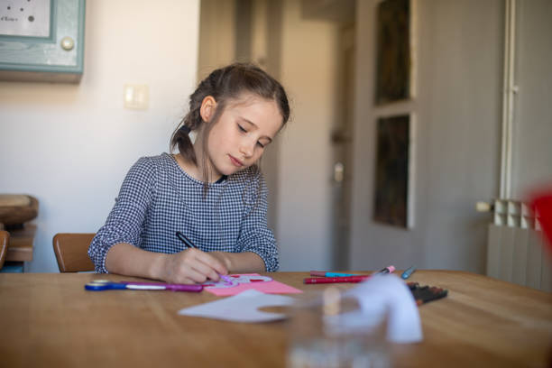 Little girl creating a Mother's Day gift at home