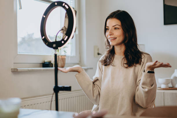 istock Woman applying make-up and recording vlog 2206045446