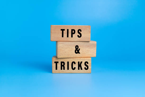istock tips and tricks words on wooden blocks isolated on blue background 2206046155