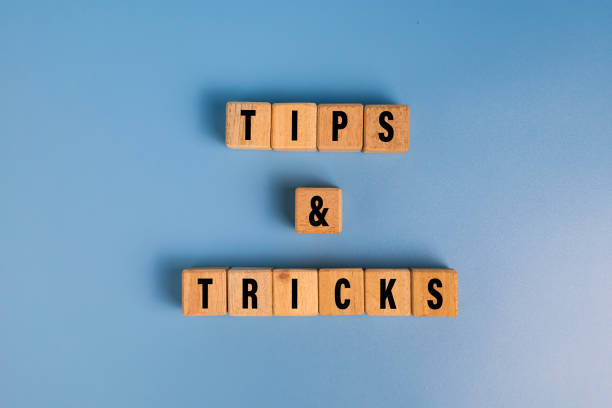 istock tips and tricks words on wooden blocks isolated on blue background 2206046268