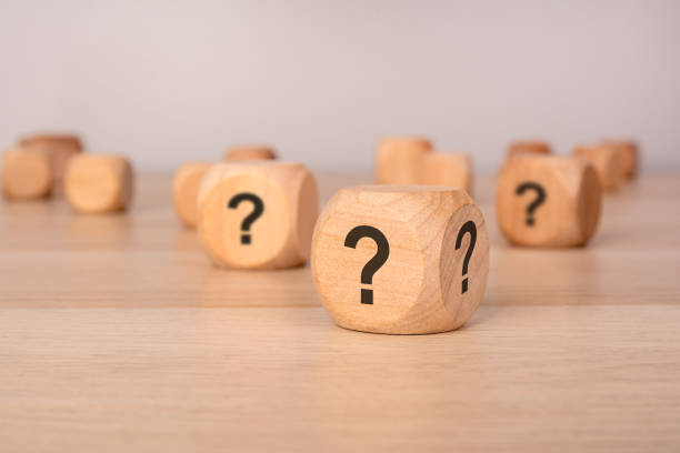 istock wooden cubes with question marks symbolizing uncertainty, decision-making, and curiosity 2206047301