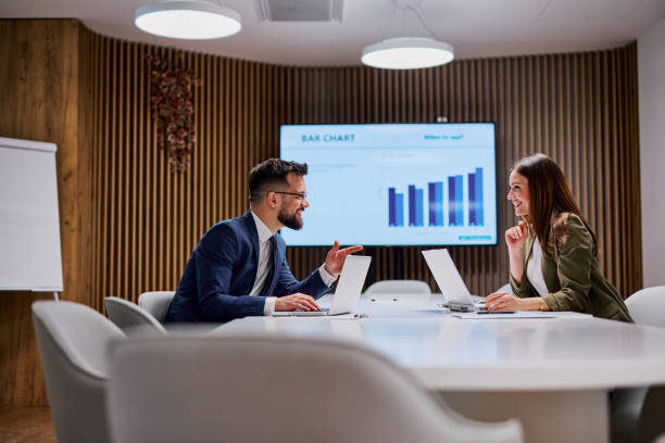 istock Business partners discussing bar chart during a meeting 2206047552