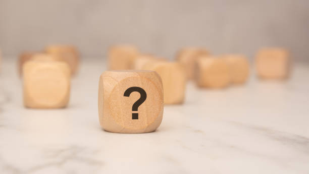 istock Wooden block with a question mark symbol, symbolizing uncertainty or decision-making 2206047779