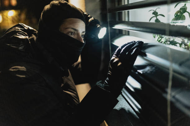istock Masked thief trying to break in 2206048067