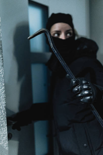 istock Masked thief trying to break in 2206048086