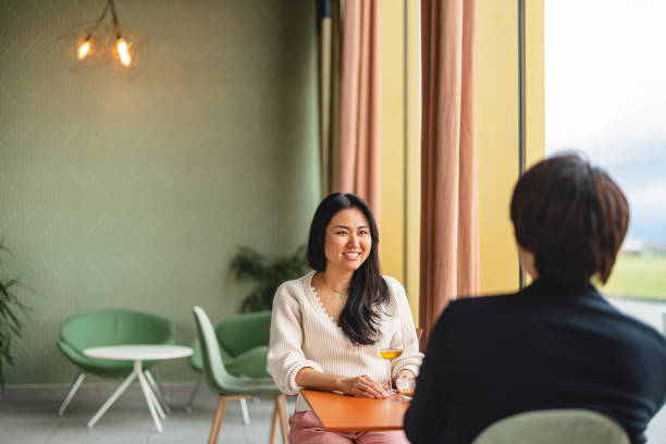 istock Japanese Couple Enjoying a Coffee Date in Modern Cafe 2206049510