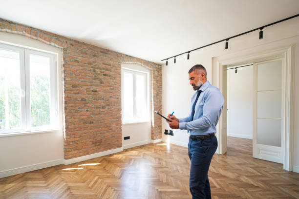 Mature man as a real estate agent stock photo