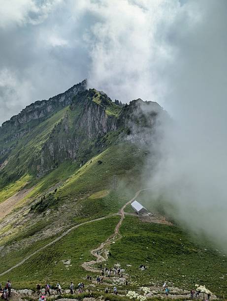 Breathtaking Majestic Mountain Landscape with Dramatic Clouds and Scenic Pathway