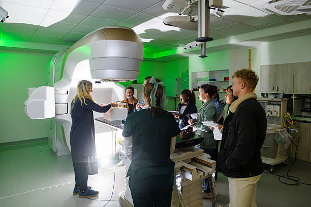 istock Medical physicist students studying advanced oncology equipment linear accelerator in a hospital training session 2206056489