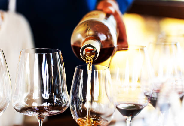 istock Pouring Amber Wine at Sophisticated Gathering 2206056750