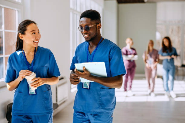 istock Two healthcare professionals discussing work at hospital 2206057209