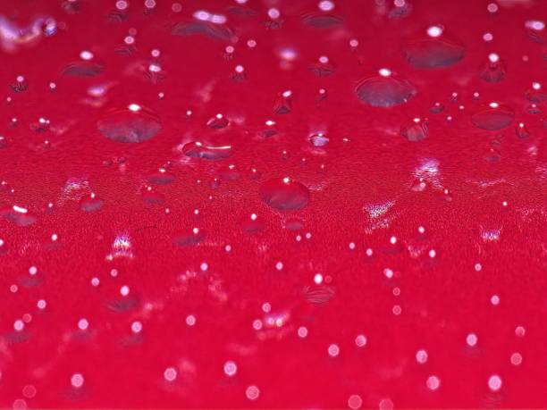 Abstract pattern of droplets on a translucent glass. Macro image of water droplets with light from above and below creating a unique abstract background.