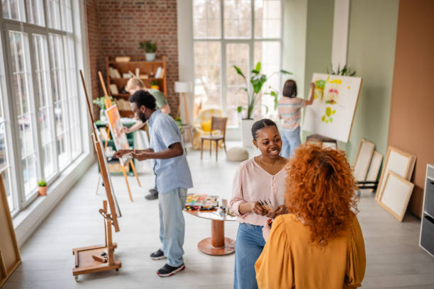 istock Creative young artists engaged in a collaborative workshop at an art studio sharing ideas and inspiration 2206059218