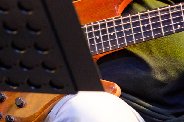 Sitting guitarist detail