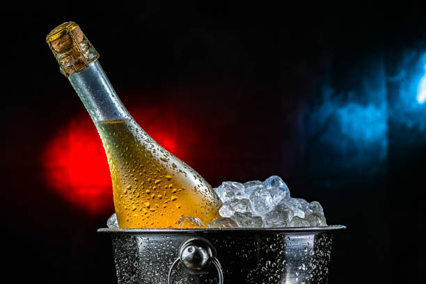 istock Bottle of sparkiling wine in bucket with crushed ice. 2206060903