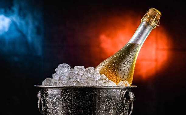 istock Bottle of sparkiling wine in bucket with crushed ice. 2206060915