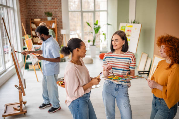 istock Young artists collaborate in a bright art studio filled with creativity and inspiration 2206065242