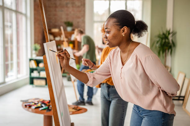 istock Young artists collaborate in a vibrant art studio, creating masterpieces and embracing creativity together 2206065749