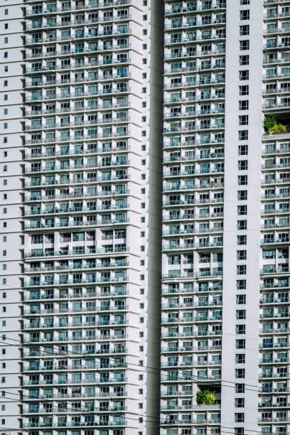 Facade of tall apartment tower in Bangkok downtown