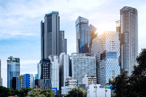 Manila skyline showcasing high-rise skyscrapers under bright daylight, representing modern urbanism.