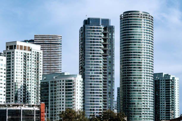 A cluster of contemporary skyscrapers showcasing architectural innovation in Manila, Philippines. This cityscape highlights modernity and the dynamic urban lifestyle, surrounded by the charm of a bustling metropolis.