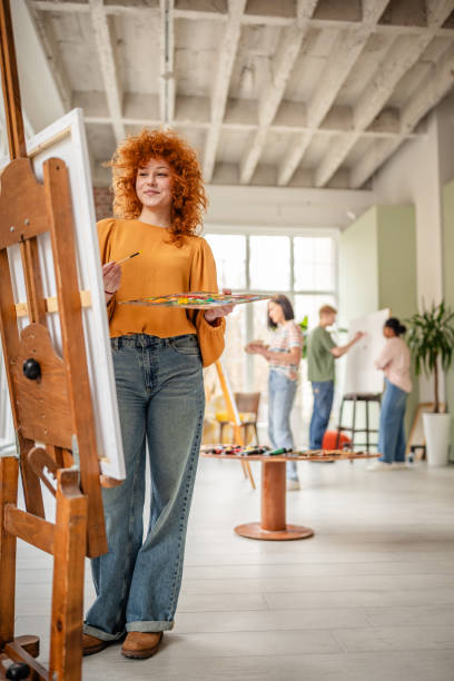 istock Young artists creating in a vibrant art studio while exploring their creativity and unique talents 2206068915