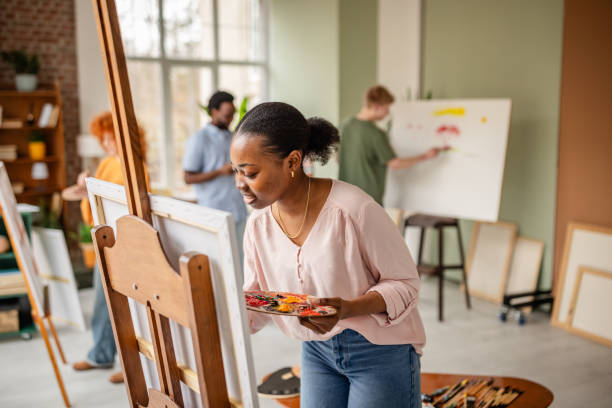 istock Young artists engage in creative activities at a vibrant art studio filled with inspiration 2206069136