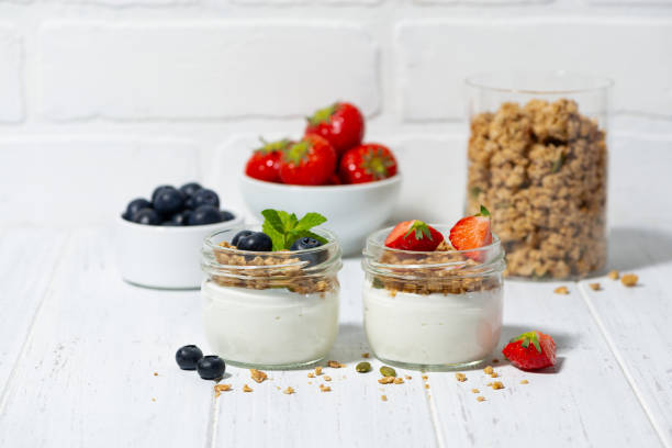 istock assorted creamy desserts with granola and fresh berries 2206069568