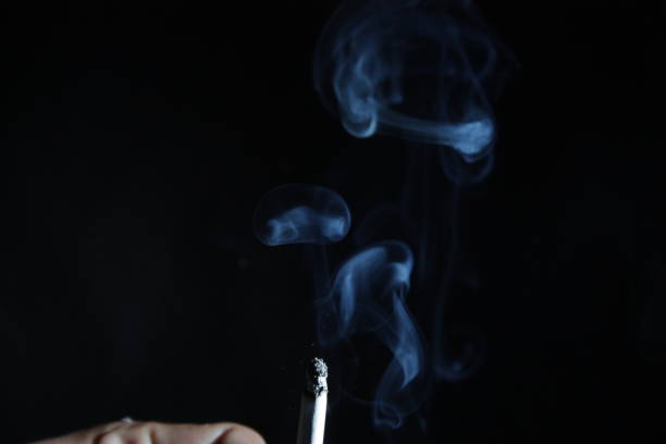 istock cigarette and smoke isolated black background 2206070007