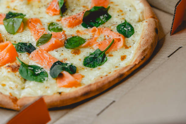 istock Pizza with salmon and spinach in box 2206070215