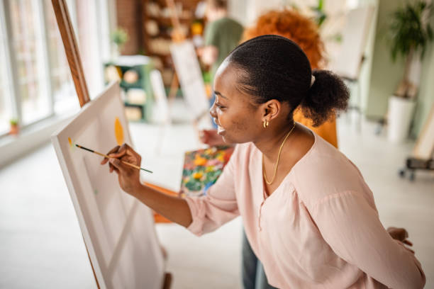 istock Young artists engaged in creativity and collaboration at an inspiring art studio 2206070779