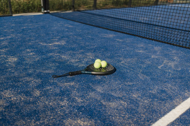 istock Tennis Racket and Balls on Blue Court Surface 2206073923