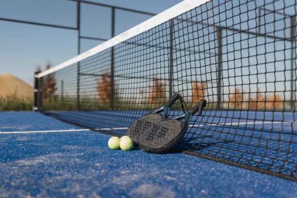 istock Tennis Equipment on Blue Court with Net 2206073941