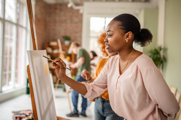 istock Young artists express creativity in vibrant art studio filled with inspiration and collaboration 2206074477
