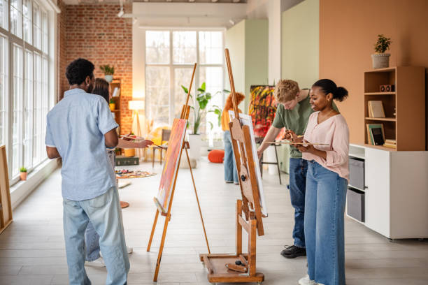 istock Young artists gather in a vibrant art studio to create and connect through creative expression and collective inspiration 2206074704
