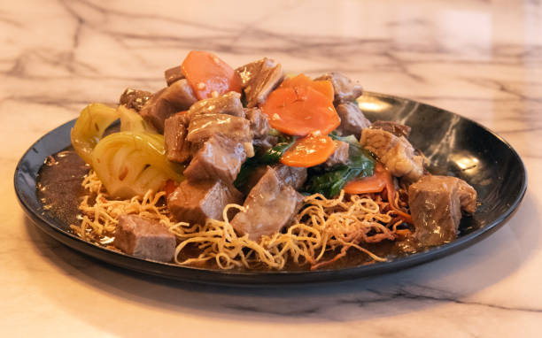 istock Beef Brisket with Pan Fried Noodles Begins 2206074949