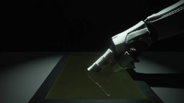 istock Robotic Arm Touching Surface in Dark Surrounding with Light Effects 2206075325