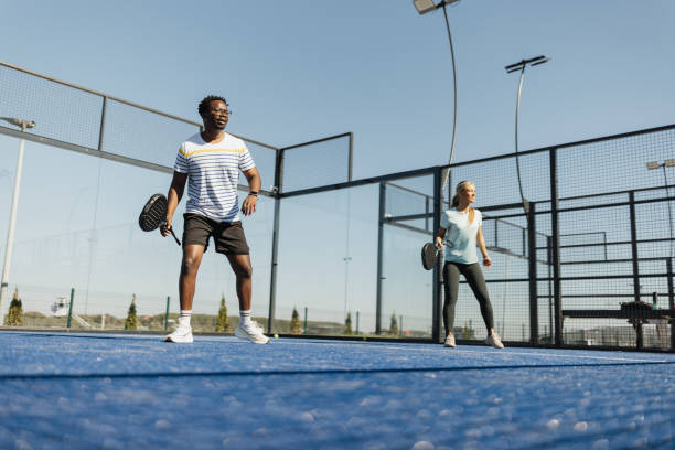 istock Focused Players in an Outdoor Paddle Match 2206075781